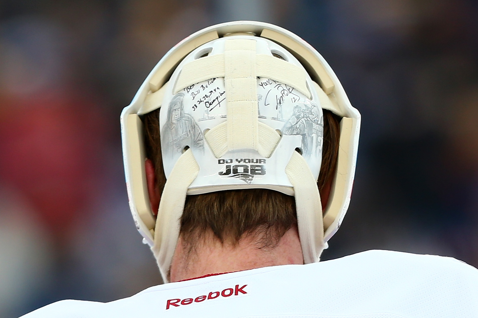 A detailed view of the helmet Montreal Canadiens goalie Mike Condon wore during the 2016 NHL Winter Classic at Gillette Stadium in Foxborough, Massachusetts, on Jan. 1, 2016. The helmet shows New England Patriots coach Bill Belichick and quarterback Tom Brady.