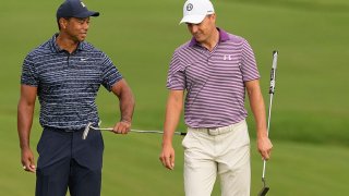 Tiger Woods and Jordan Spieth talk on the 10th green during the first round of the PGA Championship golf tournament, Thursday, May 19, 2022, in Tulsa, Okla. (AP Photo/Matt York)