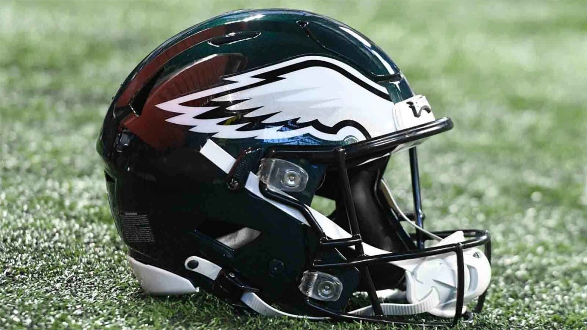 Philadelphia Eagles Football Helmets Are Lined Up On The Field