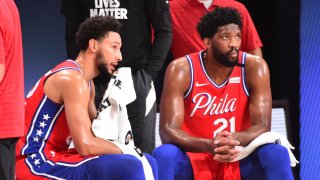 Orlando, FL – AUGUST 5: Ben Simmons #25 of the Philadelphia 76ers and Joel Embiid #21 of the Philadelphia 76ers look on during a game against the Washington Wizards on August 5, 2020 at The Arena at ESPN Wide World of Sports in Orlando, Florida. NOTE TO USER: User expressly acknowledges and agrees that, by downloading and/or using this Photograph, user is consenting to the terms and conditions of the Getty Images License Agreement. Mandatory Copyright Notice: Copyright 2020 NBAE (Photo by Jesse D. Garrabrant/NBAE via Getty Images)