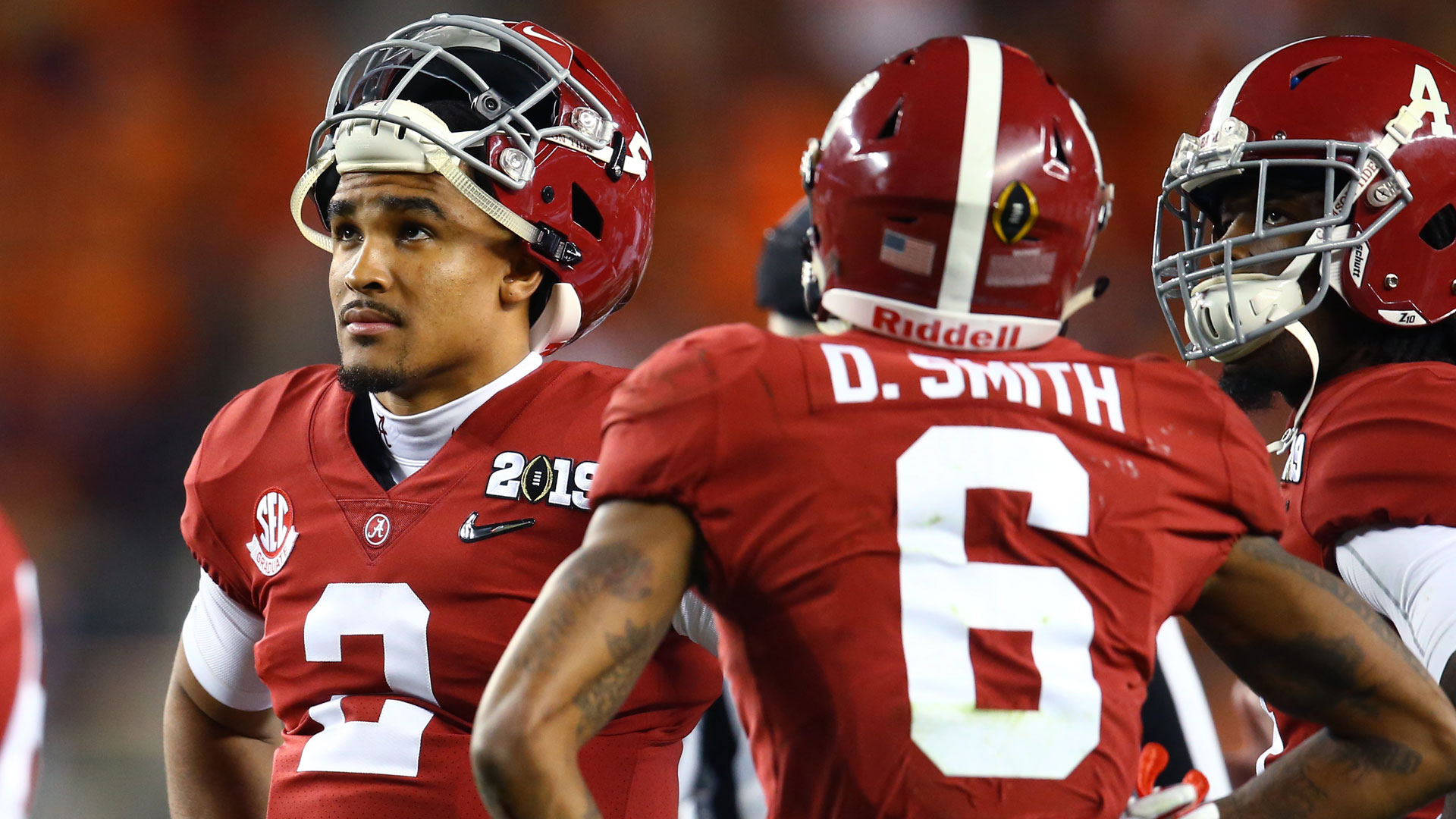 Jalen Hurts of the Philadelphia Eagles looks on along with DeVonta