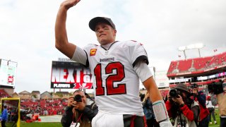 Jan 16, 2022; Tampa, Florida, USA; Tampa Bay Buccaneers quarterback Tom Brady (12) celebrates after they beat the Philadelphia Eagles in a NFC Wild Card playoff football game at Raymond James Stadium. Mandatory Credit: Kim Klement-USA TODAY Sports