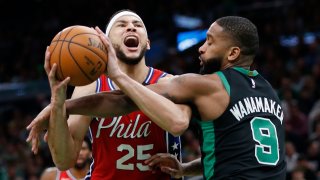 Boston Celtics’ Brad Wanamaker (9) fouls Philadelphia 76ers’ Ben Simmons (25) during the second half of an NBA basketball game in Boston, Saturday, Feb. 1, 2020. (AP Photo/Michael Dwyer)