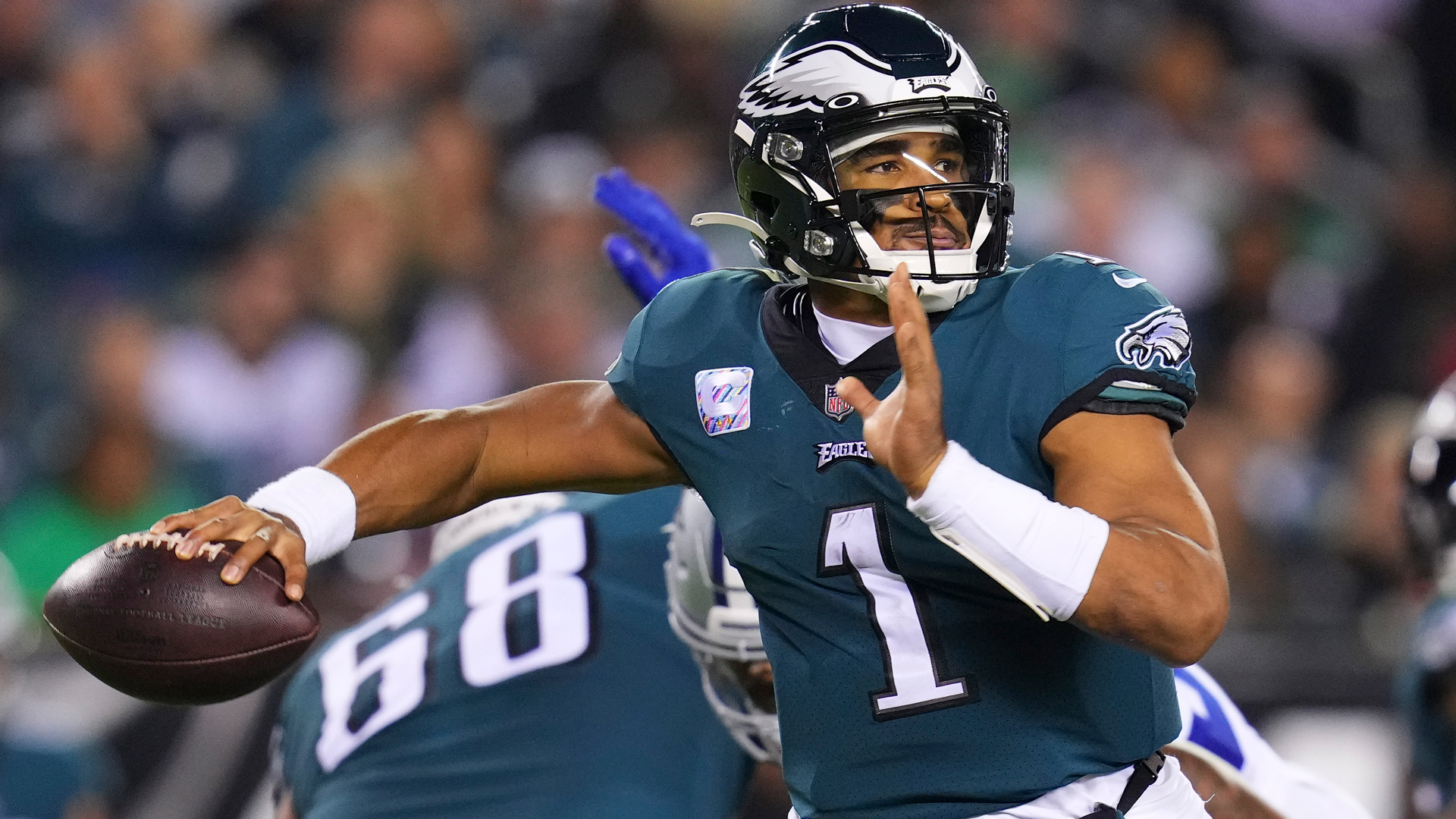 Download Jalen Hurts of the Philadelphia Eagles Drops Back to Pass Wallpaper