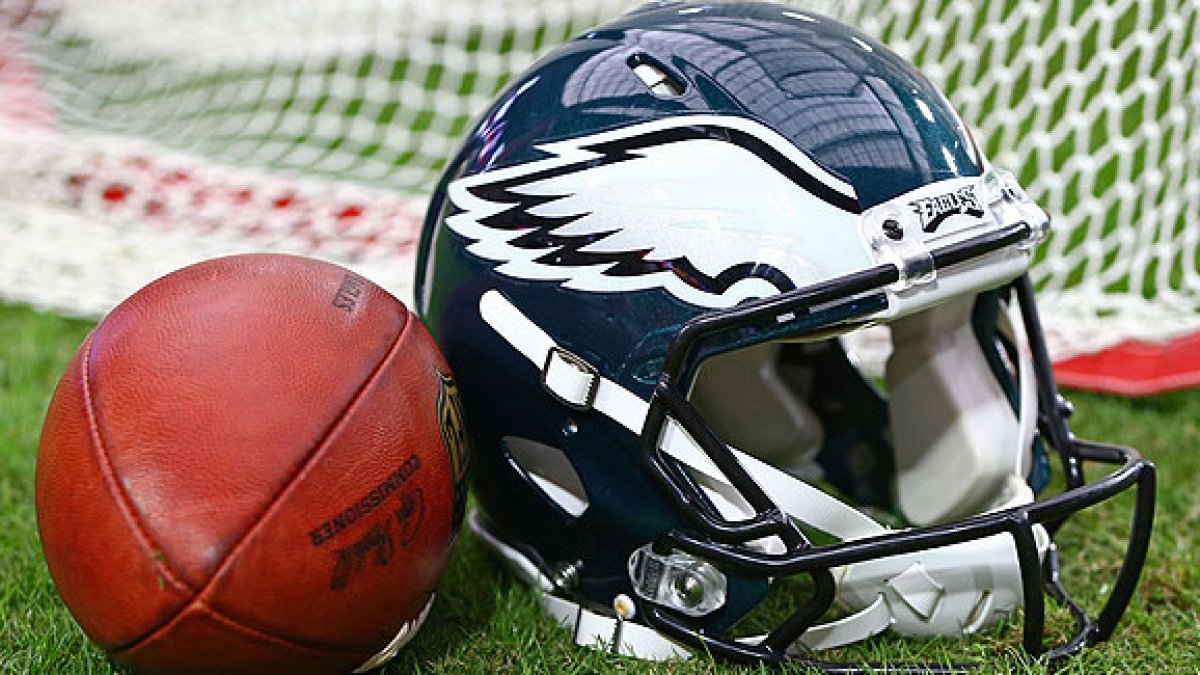 Philadelphia Eagles Football Helmets Are Lined Up On The Field