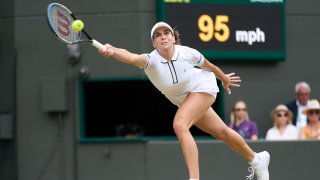 Jul 6, 2022; London, England, United Kingdom; Ajla Tomljanovic (AUS) returns a shot during her quarter finals women’s singles match against Elena Rybakina (KAZ) on Number One Court at All England Lawn Tennis and Croquet Club. Mandatory Credit: Peter van den Berg-USA TODAY Sports
