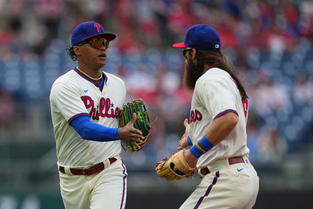 Philadelphia Phillies' Brandon Marsh takes off a batting glove