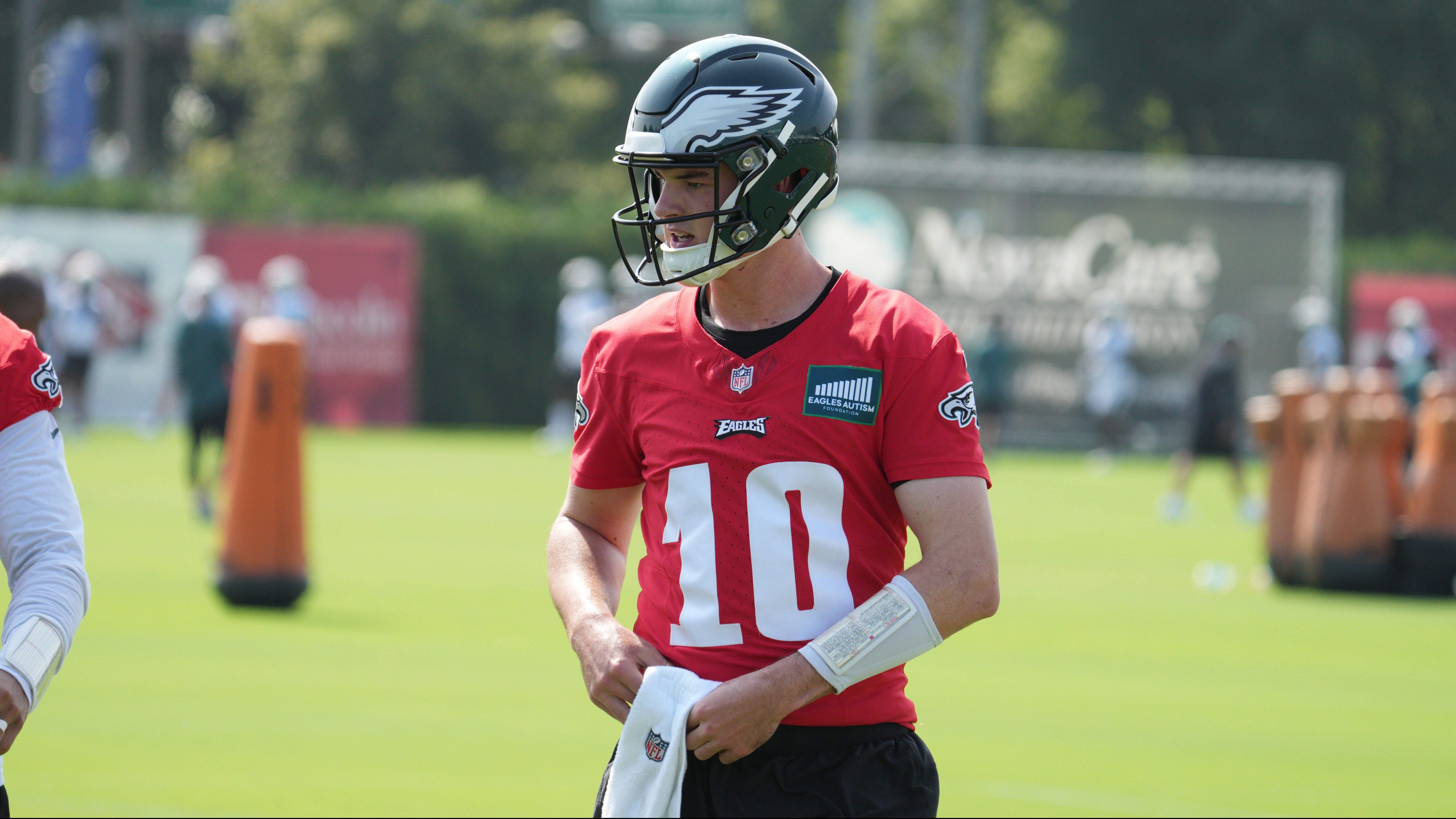 Philadelphia Eagles' Tanner McKee, left, talks to a member of the