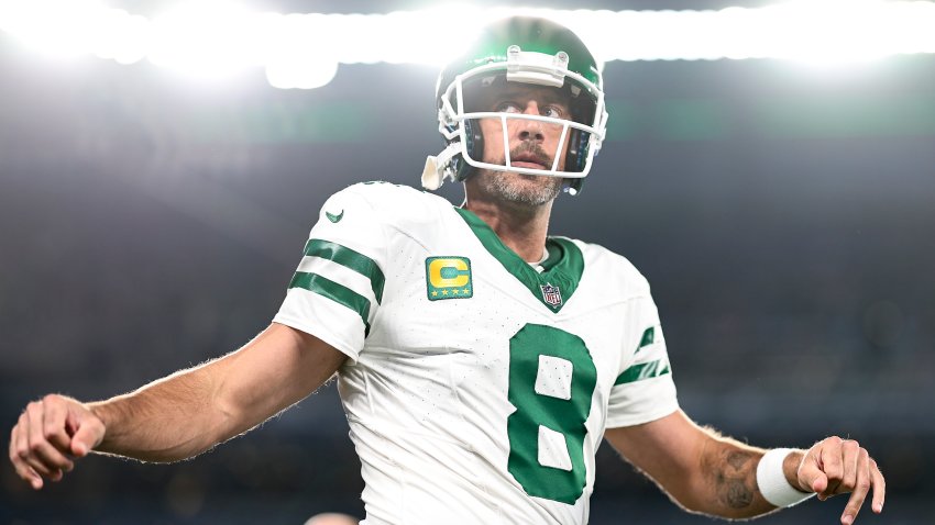 EAST RUTHERFORD, NEW JERSEY – SEPTEMBER 11: Aaron Rodgers #8 of the New York Jets stretches as he warms up prior to a game against the Buffalo Bills at MetLife Stadium on September 11, 2023 in East Rutherford, New Jersey. (Photo by Michael Owens/Getty Images)