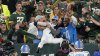 Packers fan pours beer on Lions' Amon-Ra St. Brown after ‘Lambeau Leap'
