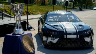 The NASCAR Bill France Cup is seen alongside an Iowa Speedway themed car during a NASCAR press conference at the Iowa State Capitol on Oct. 3, 2023 in Des Moines, Iowa. NASCAR announced that the Iowa Speedway will host its first Cup Series event in 2024.