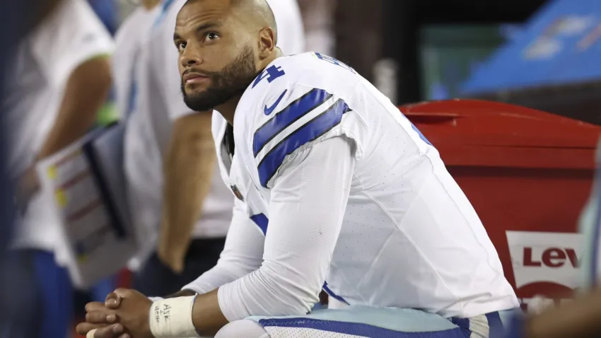 Dallas Cowboys quarterback Dak Prescott sits on the bench during the second half of an NFL football game against the San Francisco 49ers in Santa Clara, Calif., Sunday, Oct. 8, 2023.