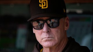 Manager Bob Melvin of the San Diego Padres standing in the dugout at RingCentral Coliseum on Sept. 16, 2023 in Oakland.