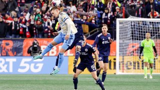 Philadelphia Union forward Mikael Uhre (7) heads the ball during an MLS first round playoff match between the New England Revolution and the Philadelphia Union