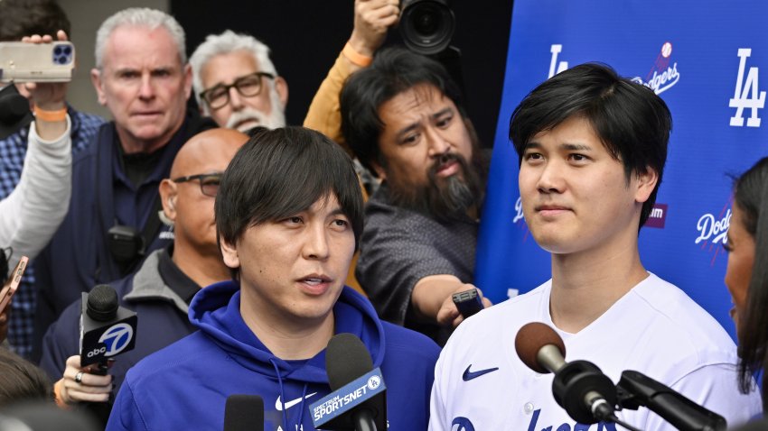 Los Angeles, CA – February 03:  Shohei Ohtani, right, of the Los Angeles Dodgers speaks to the media with the help of his interpreter Ippei Mizuhara during DodgerFest a celebration of the upcoming season with live entertainment, behind-the-scenes experiences, food, drinks and meeting the newest Dodgers at Dodger Stadium in Los Angeles on Saturday, February 3, 2024. (Photo by Keith Birmingham/MediaNews Group/Pasadena Star-News via Getty Images)