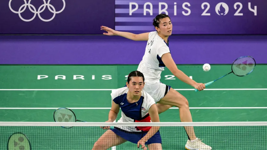 Annie and Kerry Xu compete in badminton