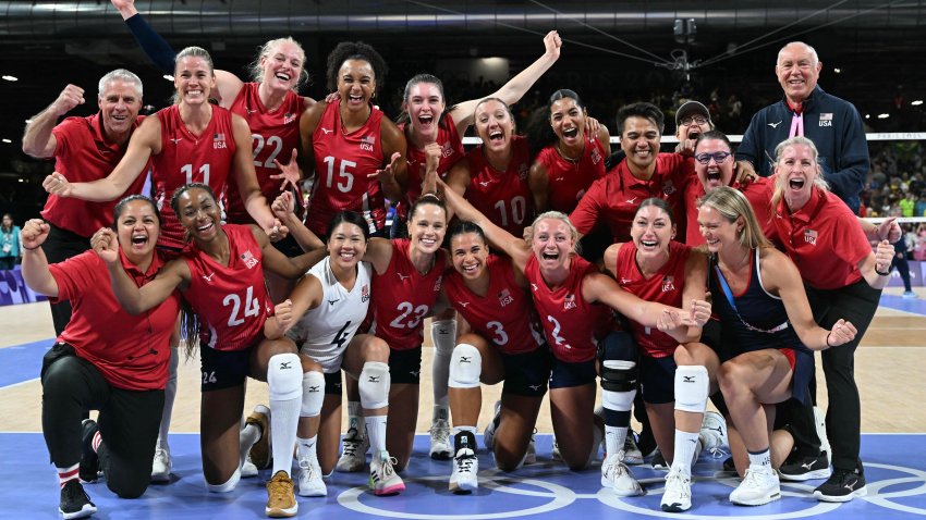 US team celebrates winning the women's volleyball semi-final match