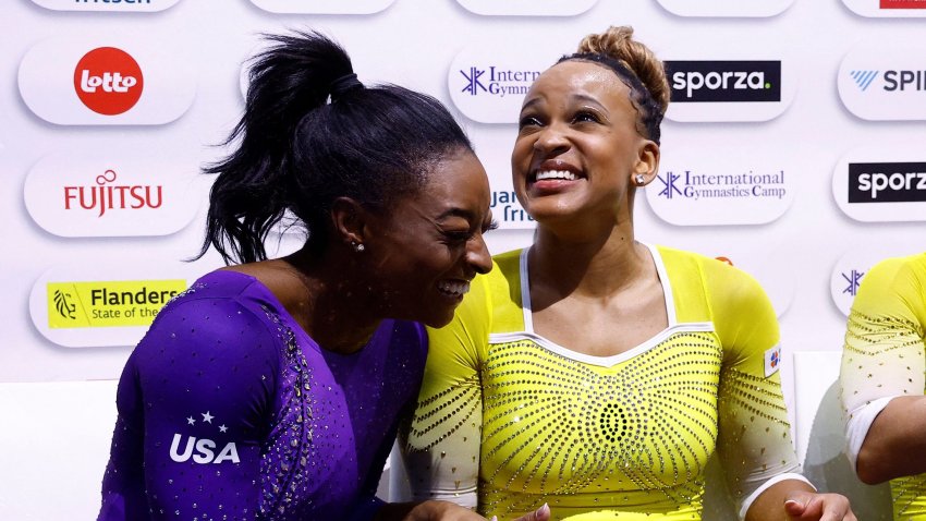 (From L) US’ Simone Biles, Brasil’s Rebeca Andrade and Brasil’s Flavia Saraiva wait for the results after competing in the Women’s Floor Final during the 52nd FIG Artistic Gymnastics World Championships, in Antwerp, northern Belgium, on October 8, 2023. (Photo by KENZO TRIBOUILLARD / AFP) (Photo by KENZO TRIBOUILLARD/AFP via Getty Images)