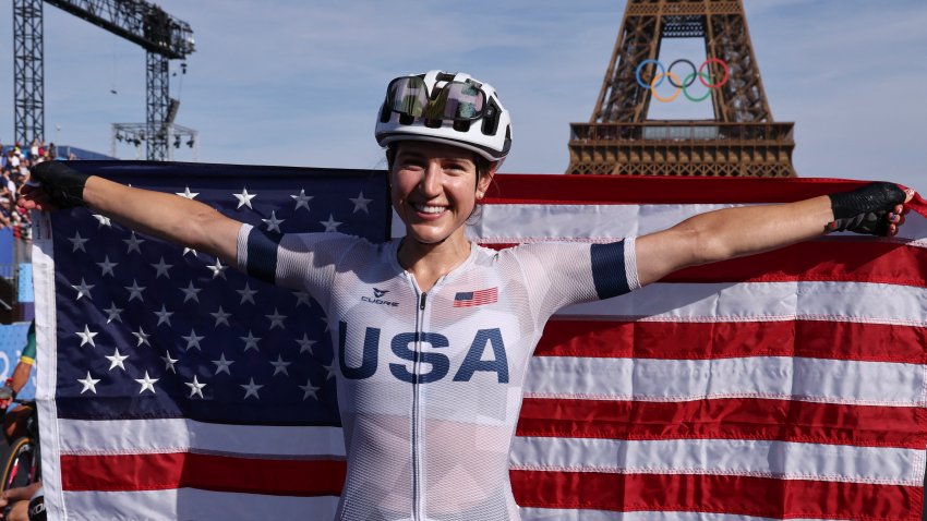 Team USA cyclist Kristen Faulkner holds American flag