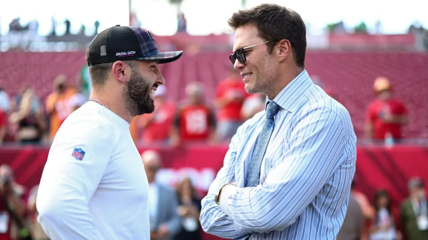 Tom Brady talks with Baker Mayfield