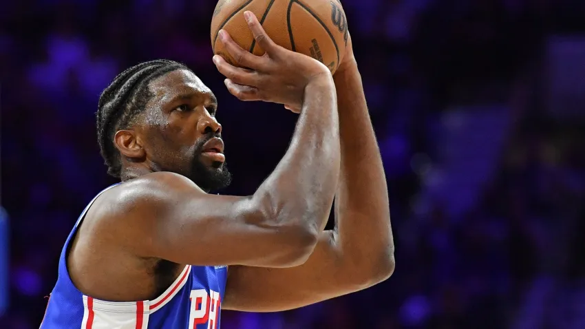 Joel Embiid shoots a basketball