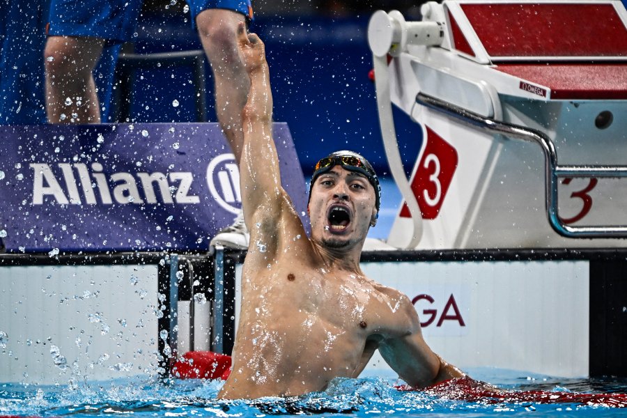 Spain’s Inigo Llopis Sanz celebrates after winning a gold medal during the men's 100m backstroke - S8 final at the Paris 2024 Paralympic Games in the Paris La Defense Arena Nanterre west of Paris on August 31 2024