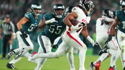 PHILADELPHIA, PENNSYLVANIA – SEPTEMBER 16: Brandon Graham #55 of the Philadelphia Eagles attempts to tackle Bijan Robinson #7 of the Atlanta Falcons at Lincoln Financial Field on September 16, 2024 in Philadelphia, Pennsylvania. (Photo by Mitchell Leff/Getty Images)