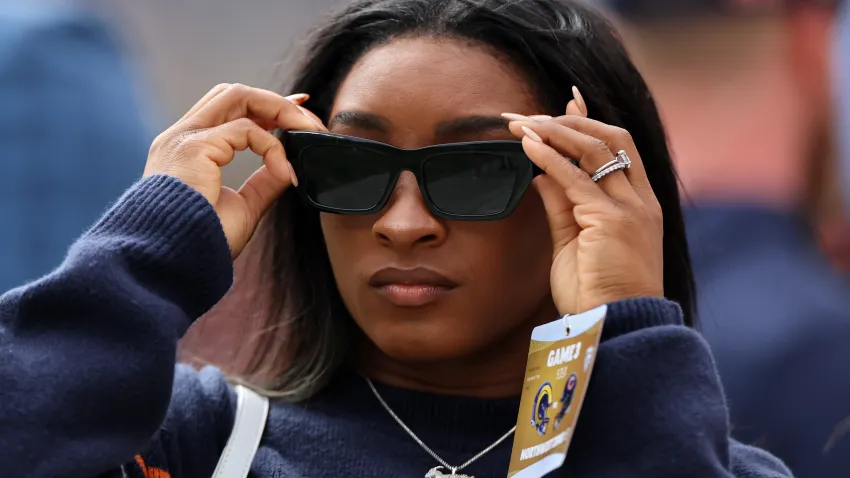 CHICAGO, ILLINOIS – SEPTEMBER 29: Gymnast Simone Biles is seen on the field before the game between the Chicago Bears and the Los Angeles Rams at Soldier Field on September 29, 2024 in Chicago, Illinois. (Photo by Michael Reaves/Getty Images)