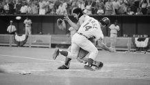 Cincinnati Reds' Pete Rose scores the winning run