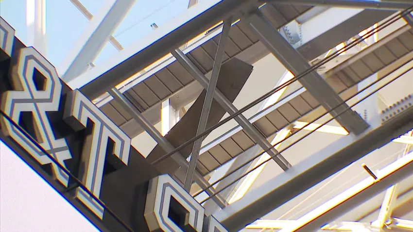 Piece of metal stuck in rafters after falling from the roof of AT&T Stadium.