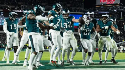 Nov 14, 2024; Philadelphia, Pennsylvania, USA; Philadelphia Eagles safety Reed Blankenship (32) celebrates with teammates after his interception during the fourth quarter against the Washington Commanders at Lincoln Financial Field. Mandatory Credit: Bill Streicher-Imagn Images