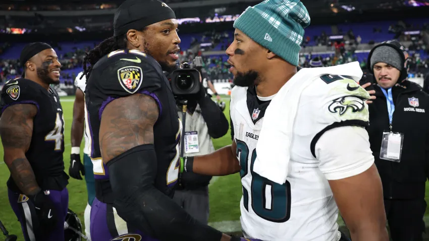 Derrick Henry of the Baltimore Ravens greets Saquon Barkley of the Philadelphia Eagles following the game at M&T Bank Stadium on December 01, 2024 in Baltimore, Maryland. Philadelphia defeated Baltimore 24-19.