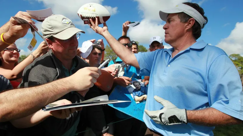 New England Patriots head coach Bill Belichick signs autographs during his pro-am appearance with golfing great Greg Norman, golf star Lexi Thompson, former NFL quarterback and TV commentator Joe Theismann and musician Kenny G at the Honda Classic in 2012.