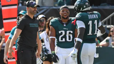 Oct 13, 2024; Philadelphia, Pennsylvania, USA; Philadelphia Eagles head coach Nick Sirianni and running back Saquon Barkley (26) celebrate touchdown catch by wide receiver A.J. Brown (11) against the Cleveland Browns during the second quarter at Lincoln Financial Field. Mandatory Credit: Eric Hartline-Imagn Images