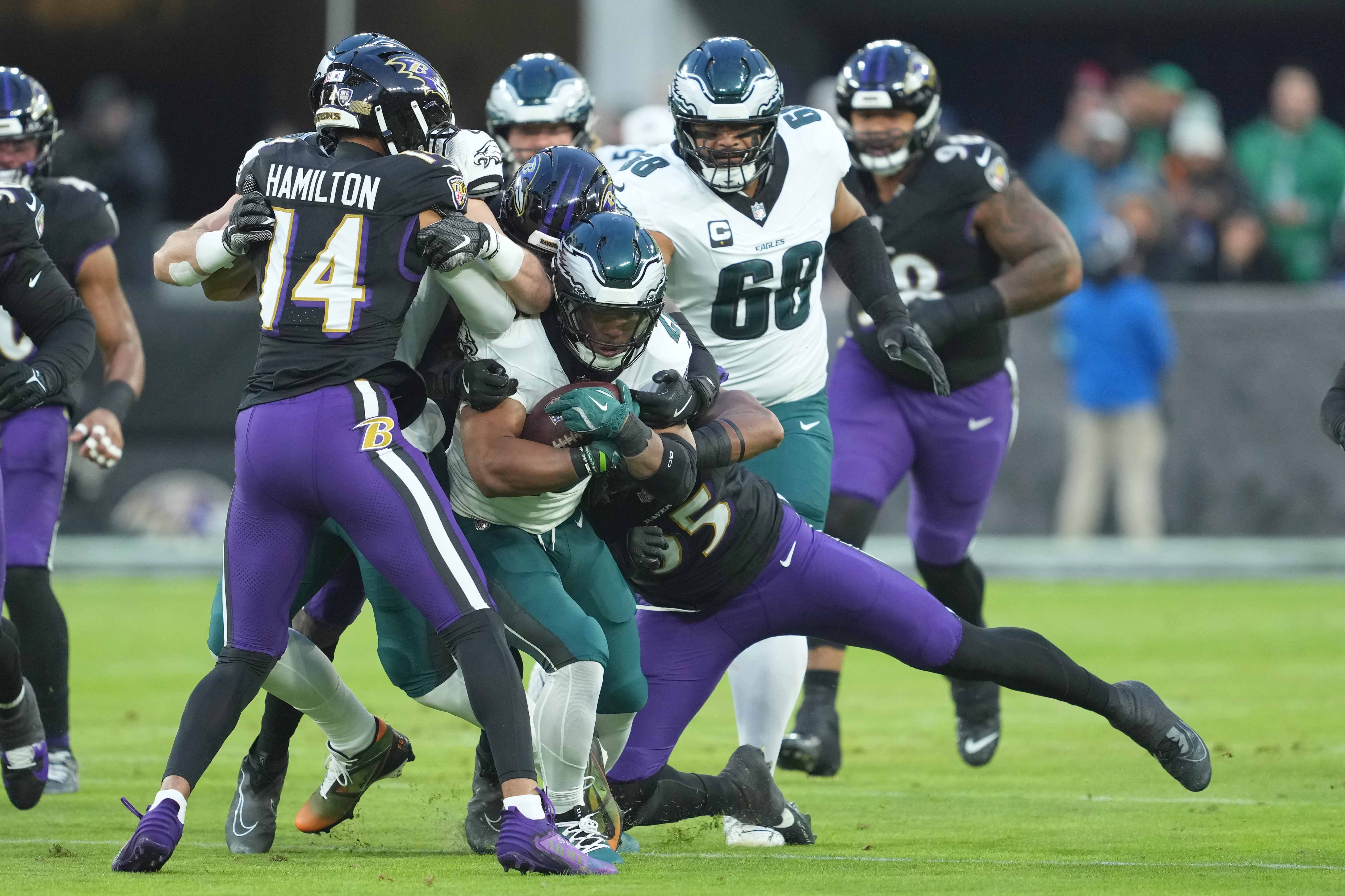 Dec 1, 2024; Baltimore, Maryland, USA; Philadelphia Eagles running back Saquon Barkley (26) gains yardage in the first quarter against the Baltimore Ravens at M&T Bank Stadium. Mandatory Credit: Mitch Stringer-Imagn Images