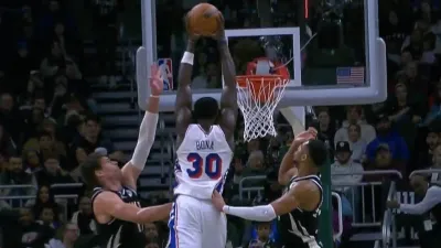 Air Adem! Bona soars for a monster dunk against the Bucks