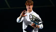 Italy's Jannik Sinner celebrates with the Norman Brookes Challenge Cup trophy after defeating Germany's Alexander Zverev during their men's singles final match on day fifteen of the Australian Open tennis tournament in Melbourne on January 26, 2025. (Photo by Yuichi YAMAZAKI / AFP) / -- IMAGE RESTRICTED TO EDITORIAL USE - STRICTLY NO COMMERCIAL USE -- (Photo by YUICHI YAMAZAKI/AFP via Getty Images)