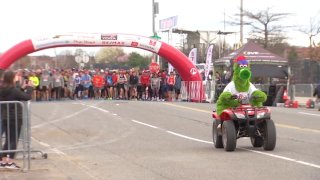 Phillie Phanatic on ATV leads runners in Phillies 5K.