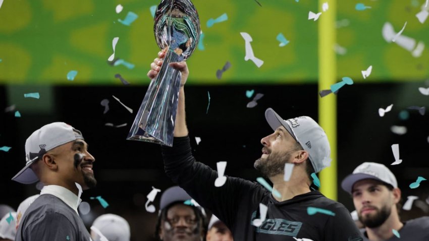 Philadelphia Eagles head coach Nick Sirianni and Jalen Hurts celebrate with the Vince Lombardi Trophy after winning Super Bowl LIX