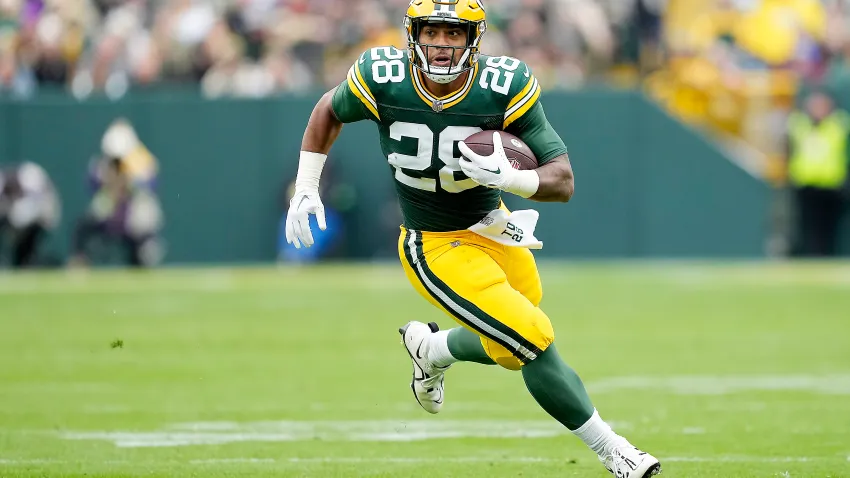 GREEN BAY, WISCONSIN – OCTOBER 29: AJ Dillon #28 of the Green Bay Packers runs with the ball after a fourth quarter catch against the Minnesota Vikings at Lambeau Field on October 29, 2023 in Green Bay, Wisconsin. (Photo by Patrick McDermott/Getty Images)