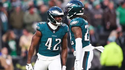 Jan 12, 2025; Philadelphia, Pennsylvania, USA; Philadelphia Eagles linebacker Oren Burks (42) reacts with cornerback Kelee Ringo (22) against the Green Bay Packers in an NFC wild card game at Lincoln Financial Field. Mandatory Credit: Bill Streicher-Imagn Images