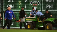 A fan is carted off the field after falling from the stands during the seventh inning of the game between the Chicago Cubs and the Pittsburgh Pirates at PNC Park on April 30, 2025 in Pittsburgh, Pennsylvania.
