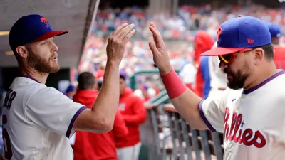 PHILADELPHIA, PA – APRIL 23: Starting pitcher Zack Wheeler #45 of the Philadelphia Phillies is congratulated by Kyle Schwarber after walking off the field in the sixth inning of a game against the Colorado Rockies at Citizens Bank Park on April 23, 2023 in Philadelphia, Pennsylvania. The Phillies defeated the Rockies 9-3. (Photo by Rich Schultz/Getty Images)
