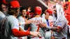 Phils make quick work of Reds to win fourth straight, climb 20 games over .500