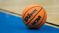 A detailed view of the game ball with the NCAA logo
