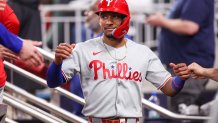 Jun 27, 2025; Atlanta, Georgia, USA; Philadelphia Phillies center fielder Johan Rojas (23) celebrates with teammates after scoring a run against the Atlanta Braves in the ninth inning at Truist Park. Mandatory Credit: Brett Davis-Imagn Images