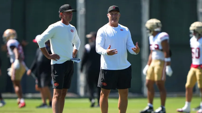 SANTA CLARA, CALIFORNIA – AUGUST 04: Head coach Mike Shanahan (L) and general manager John Lynch (R) of the San Francisco 49ers looks on during practice at training camp at SAP Performance Facility on August 04, 2025 in Santa Clara, California. (Photo by Thearon W. Henderson/Getty Images)