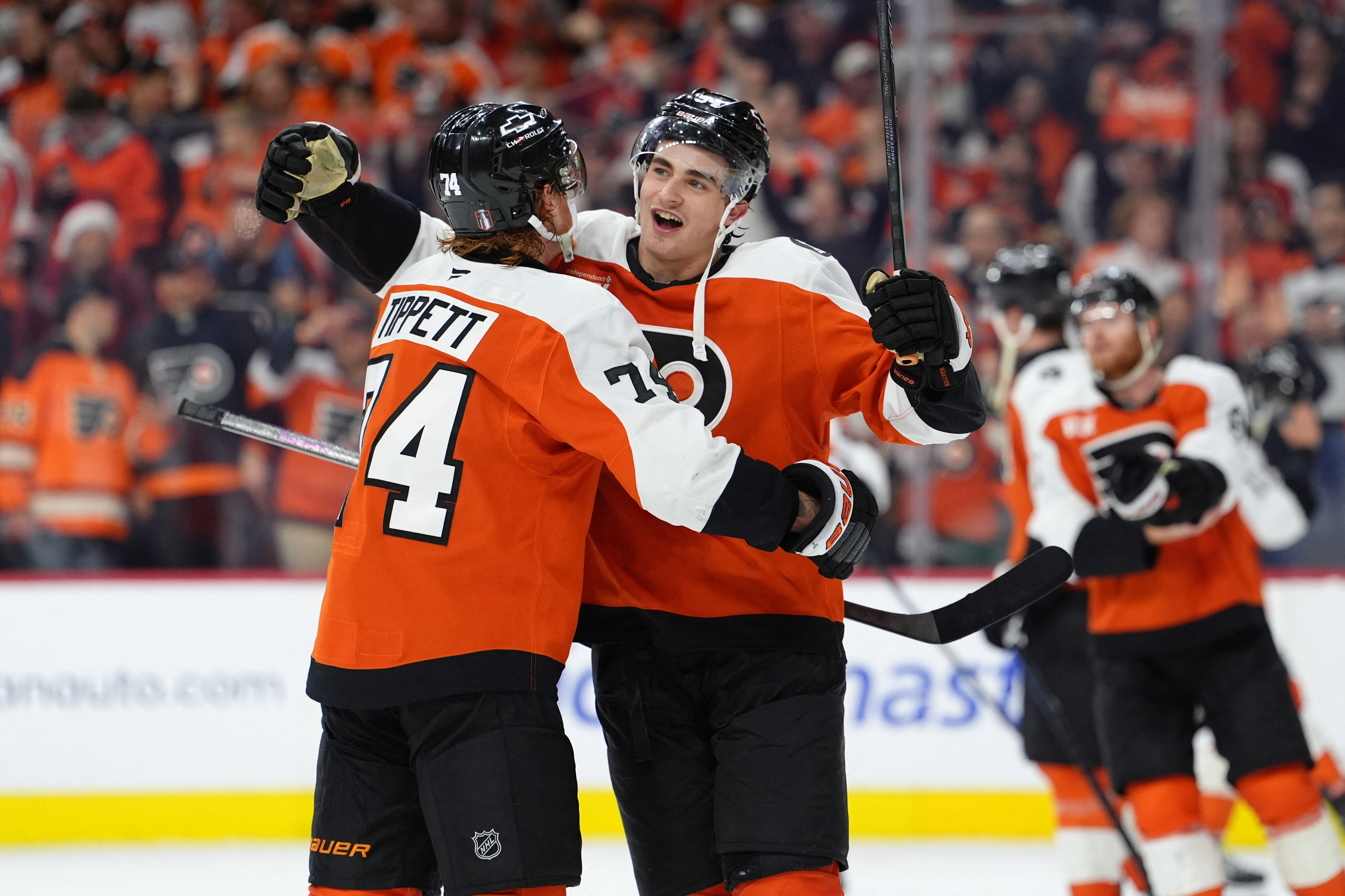 Apr 29, 2026; Philadelphia, Pennsylvania, USA; Philadelphia Flyers right wing Porter Martone (94) celebrates with right wing Owen Tippett (74) after game six of the first round of the 2026 Stanley Cup Playoffs against the Pittsburgh Penguins at Xfinity Mobile Arena. Mandatory Credit: Kyle Ross-Imagn Images