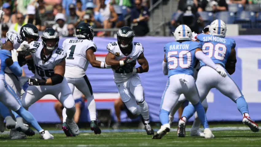 Sep 20, 2026; Nashville, Tennessee, USA;  Philadelphia Eagles quarterback Jalen Hurts (1) passes the ball to Philadelphia Eagles running back Saquon Barkley (26) during the first quarter at Nissan Stadium.  Mandatory Credit: Steve Roberts-Imagn Images