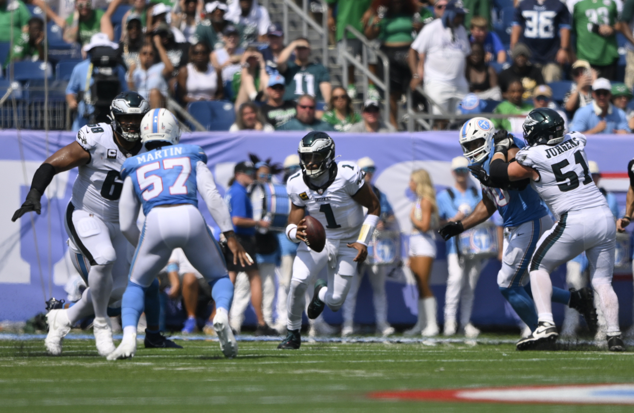 Sep 20, 2026; Nashville, Tennessee, USA;  Philadelphia Eagles quarterback Jalen Hurts (1) scrambles during the third quarter at Nissan Stadium.  Mandatory Credit: Steve Roberts-Imagn Images